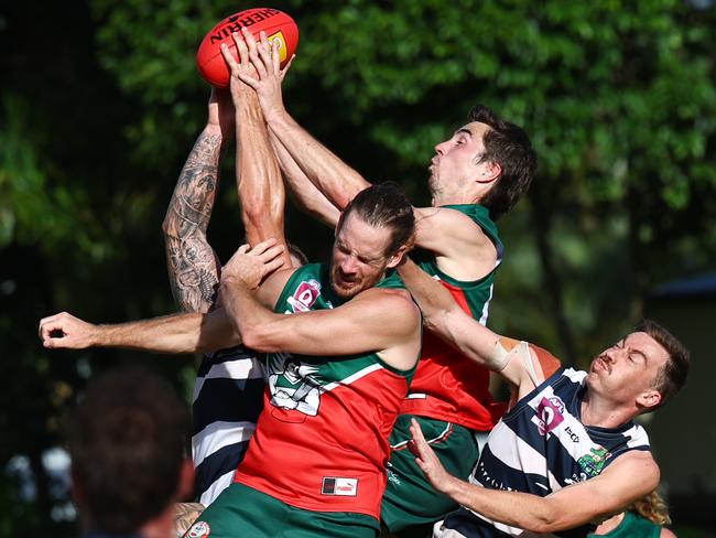 Cutters' Cody Schutt soars over the top of the pack to take a mark in the AFL Cairns senior men's match between the South Cairns Cutters and the Port Douglas Crocs, held at Fretwell Park. Picture: Brendan Radke