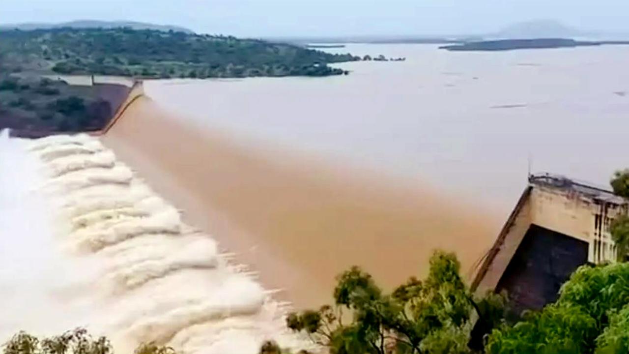 Water flows over the spillway at the Burdekin Falls Dam on Lake Dalrymple