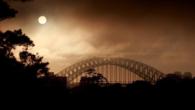 The Sydney Harbour Bridge was blanketed by heavy fog. Picture: NCA NewsWire / Dylan Coker