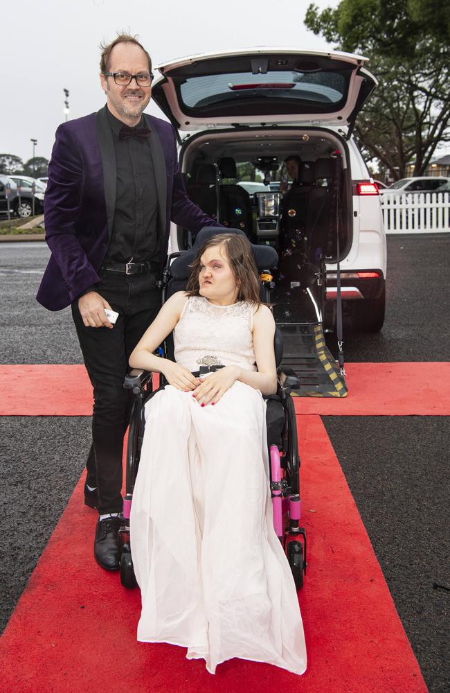 Graduate Chloe Hitzke with dad Nathan Hitzke at Clifford Park Special School formal at Clifford Park Racecourse, Wednesday, November 20, 2024. Picture: Kevin Farmer