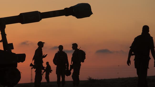 Israeli soldiers prepare their artillery unit near the border with Gaza Strip on Friday. Picture: Amir Levy/Getty Images