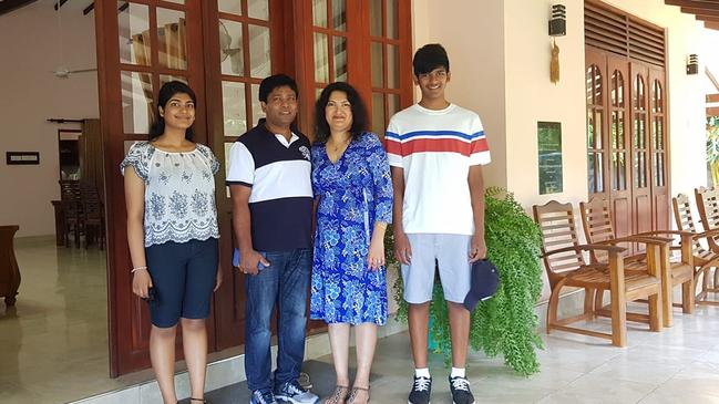 Calvin Wijeweera with his sister Ovindi, dad Sandun and mum Anoma.