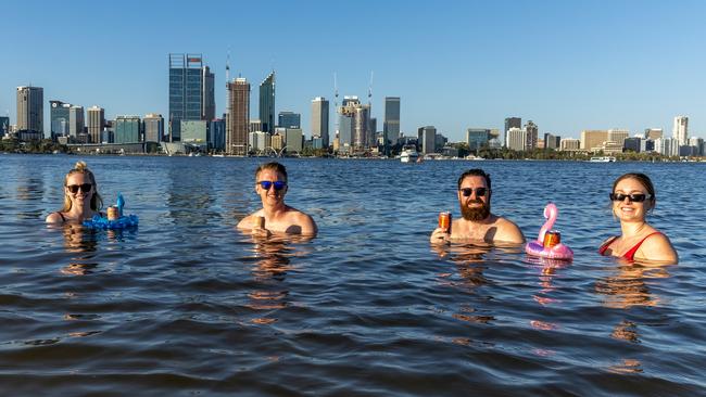 PERTH, AUSTRALIA – JANUARY 22: Sarah Jackson, Sam Rowe, Lachlan Alexander and Monica Lewis swim in Perth’s Swan River during a 2022 heatwave. Picture: Getty Images