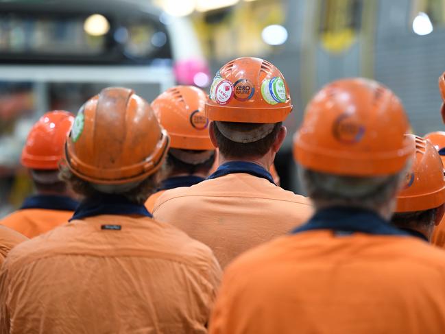 Workers listen to an address by Queensland Premier Annastacia Palaszczuk as she visits the Downer Rail workshop in Maryborough, Monday, September 11, 2017. The Palaszczuk Government has today confirmed a $70 million pipeline of projects for Downer EDIÕs Maryborough workshop. (AAP Image/Dan Peled) NO ARCHIVING