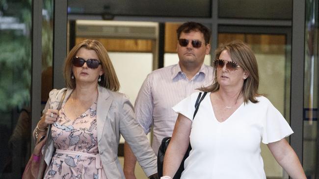 Marilyn Burdon’s children, pictured leaving the Coroner's Court of Victoria on Monday, want answers on how a man prohibited from owning guns was able to shoot their mother. Picture: NCA NewsWire / David Geraghty