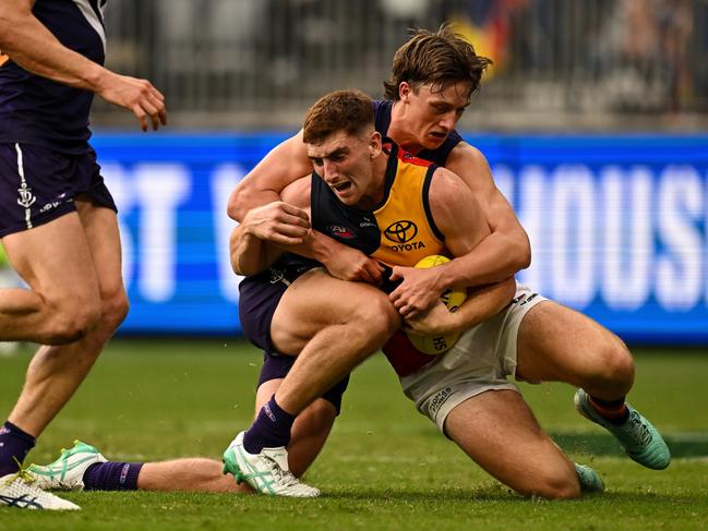 Mark Keane is brought down by Jye Amiss. Picture: Daniel Carson/AFL Photos via Getty Images