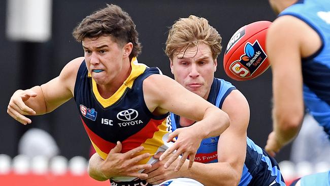 Ned McHenry is tackled by Sturt's Sam Colqhoun. Picture: Tom Huntley