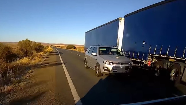 Mr Quinn swerves into the stop lane and narrowly avoids colliding head on with the car.