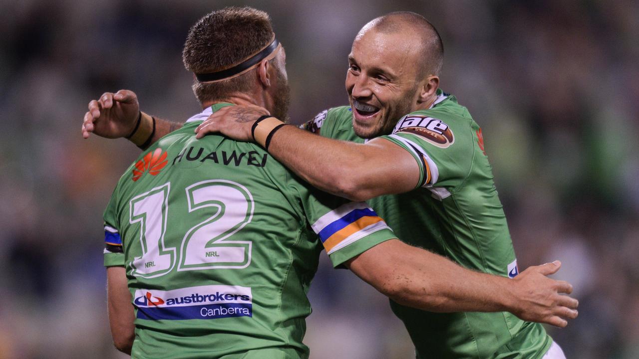 Elliot Whitehead and Josh Hodgson celebrate a try in the Raiders victory over the Eels. 