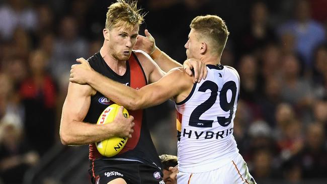 Rory Laird wraps up James Stewart of Essendon. Picture: Quinn Rooney/Getty Images