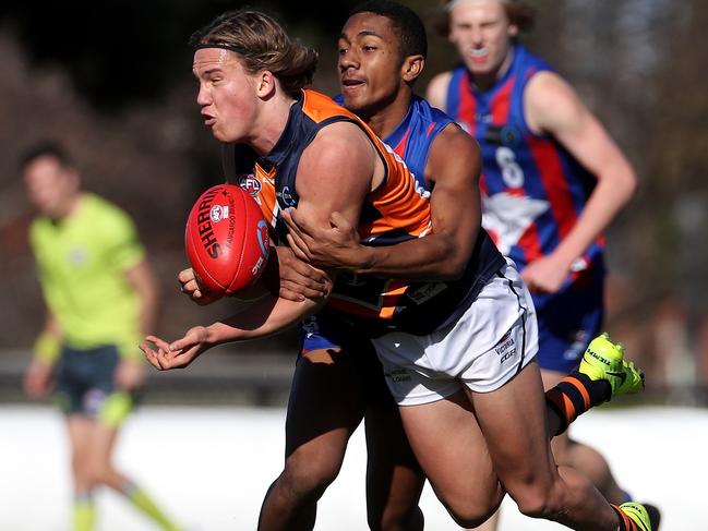 Jack Bytel fires out a handball against Oakleigh Chargers. Picture: Mark Dadswell