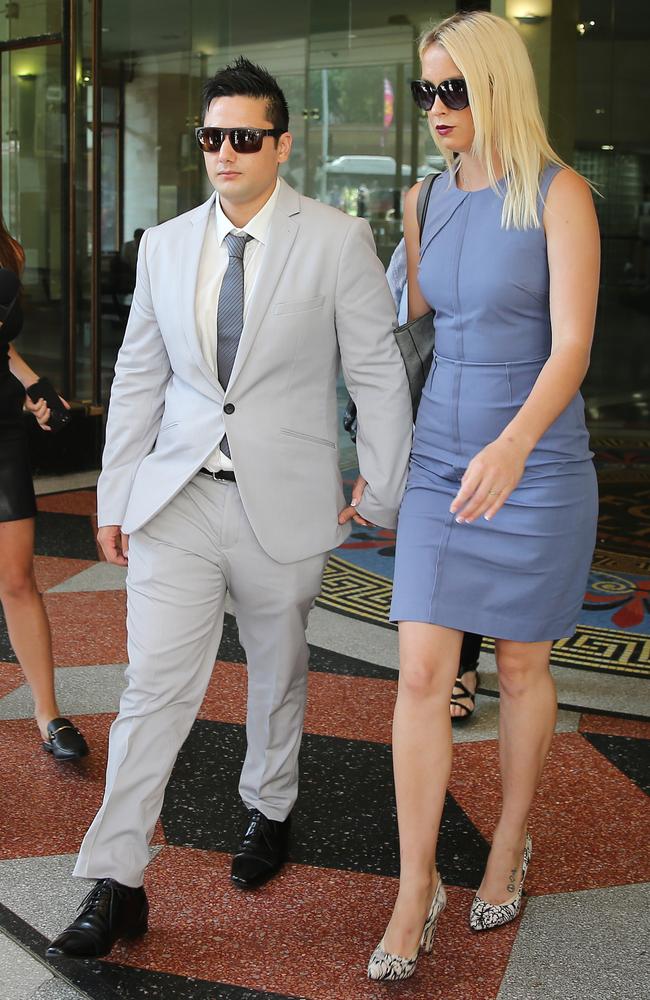 Blake Davis and Hannah Quinn hand-in-hand at Downing Centre Local Court. Picture: Richard Dobson