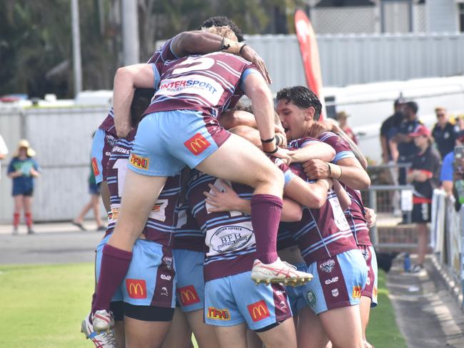 The CQ Capras celebrate one of their eight tries against the Sunshine Coast Falcons.