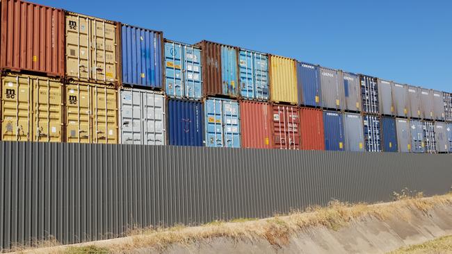 The shipping containers full of recycling left behind by SKM Recycling at WIngfield. Picture: Colin James