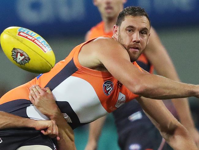 Sydney's Callum Sinclair tackles Giants Shane Mumford during the AFL Derby match between the Sydney Swans and GWS Giants at the SCG. Picture. Phil Hillyard