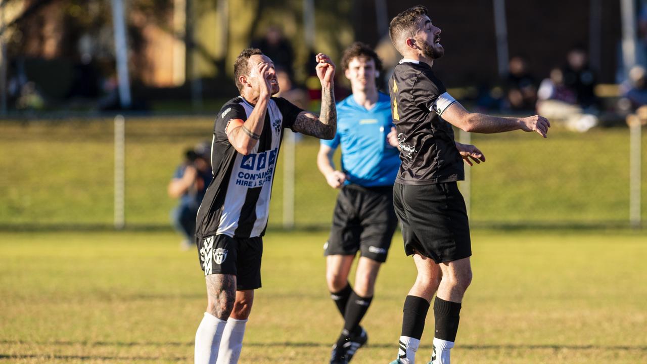 Trent Ingleton (left) of Willowburn against Tom Fowler of West Wanderers in FQPL Men Darling Downs Presidents Cup football at West Wanderers, Sunday, July 24, 2022. Picture: Kevin Farmer