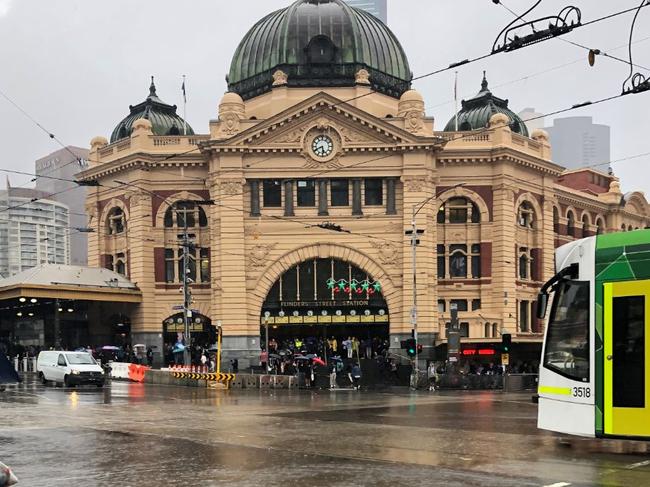 Melbourne's busiest intersection lies underwater after a storm brought flash flooding. Picture: Twitter