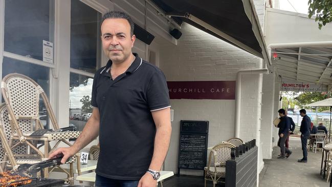 Churchill Cafe's Hamid Nasirzadeh says he has lost more than 20 per cent of his usual takings since level crossing removal works began in Mont Albert. Picture: Kiel Egging.