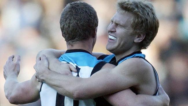 AS MATES. Port Adelaide premiership teammates Damien Hardwick, left, and Kane Cornes are now in a verbal stoush over Richmond’s form and Cornes’ media commentary on the Tigers.