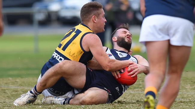 Nick Milne takes down Andrew Sturgess. Picture: Josie Hayden