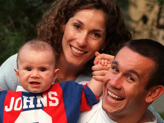 Newcastle player Matthew Johns at home with wife Trish & son Jack, 04/98.Rugby League / John/fam