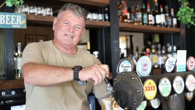 The Barrier Reef Hotel venue manager Stephen Boyd pours a beer at the hotel's Barbary Coast Bar. Photo: Catherine Duffy.