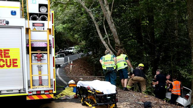 Paramedics and Queensland fire and rescue personal work to free a trapped motorist in 2020.