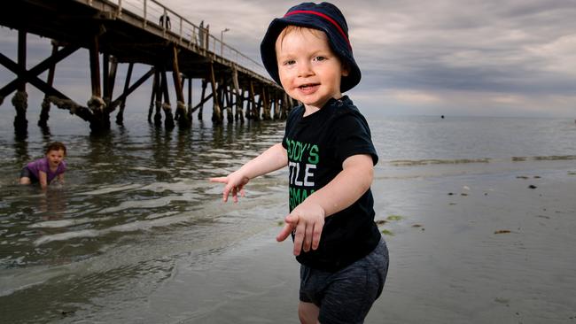 Maximus, 2, playing at Semaphore beach. Picture: AAP / Morgan Sette