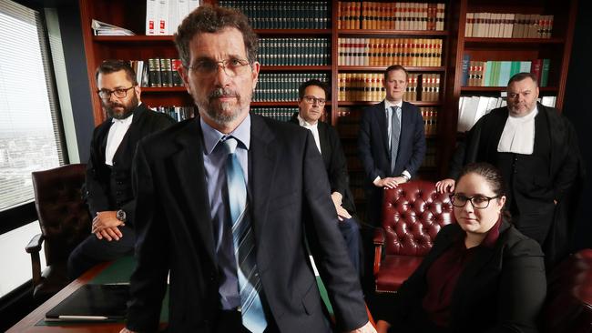 Former JCU climate scientist Peter Ridd with his legal team. 