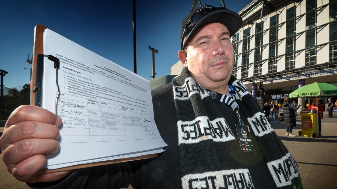 Pies fans are agitating to overthrow the board. Members signing petition floating Before the Magpies and Port Adelaide game at MCG. Petition organiser David Hatley (40 year Collingwood member), with petition. Picture: Tony Gough