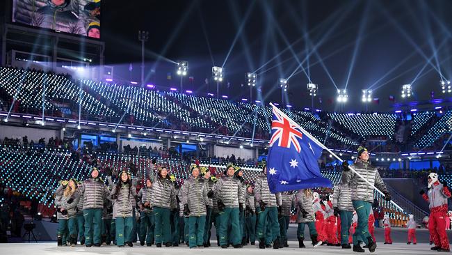 Flag bearer Scotty James leads Australia out during the Opening Ceremony of the PyeongChang 2018 Winter Olympic Games. Picture: Getty Images.