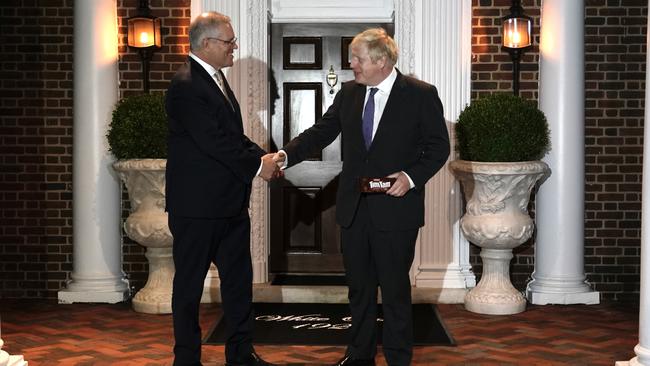 Prime Minister Scott Morrison greets UK Prime Minister Boris Johnson in Washington. Picture: Adam Taylor