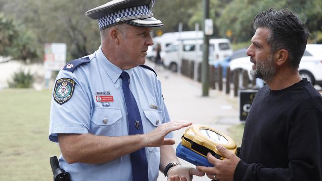 Tweed Byron Police District Inspector Matt Kehoe with Michael Ibrahim, who was involved in a campaign to get defibrillators on local beaches after the death of local surfer Philip Jones at Wategos. Picture: Liana Boss