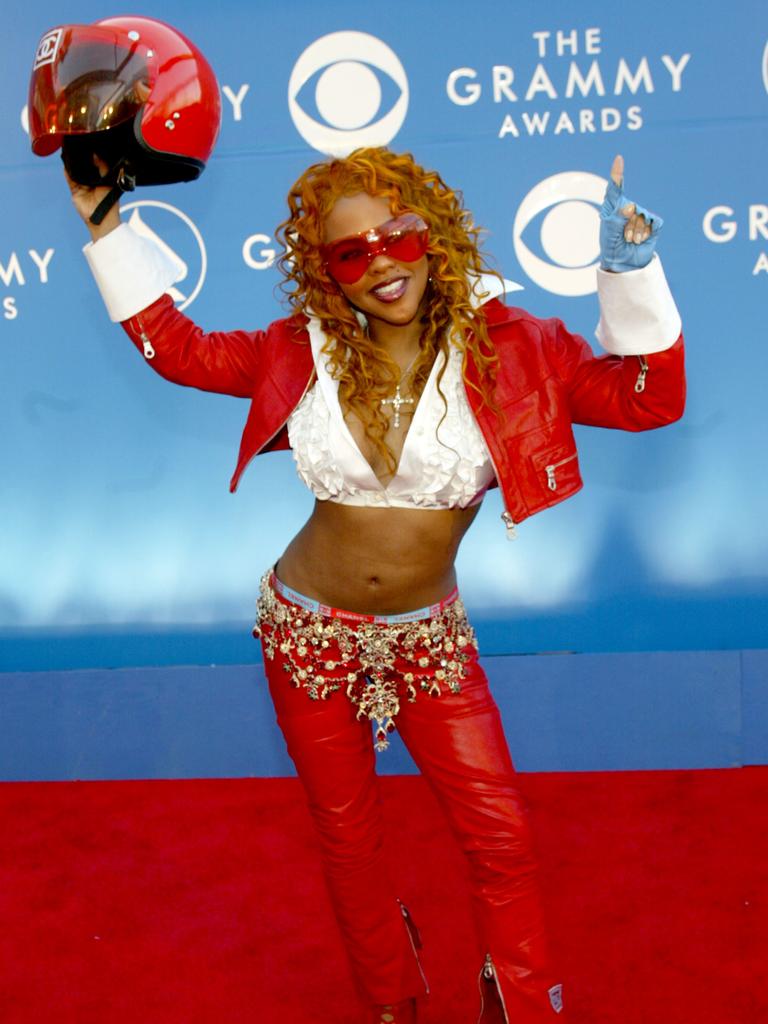 We’re not sure if Lil’ Kim arrived on the back of a motorbike or whether she stores her wallet and keys in a helmet. Either way, it’s an interesting look for the pint-sized R&amp;B star at the 2002 Grammys. Picture: Getty