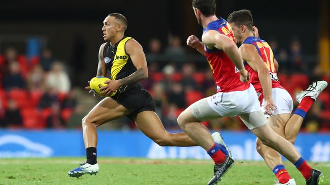 Shai Bolton leaves the Lions in his wake at Metricon Stadium.