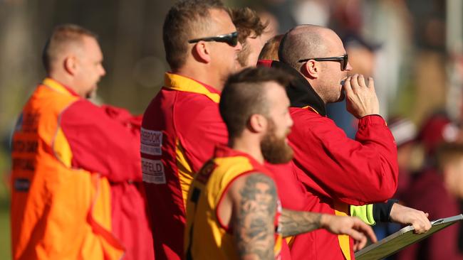 Morphettville Park coaches and players watch on against Colonel Light Gardens on Saturday, July 22, 2017. (AAP Image/James Elsby).