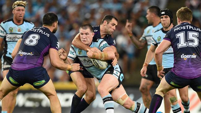 Paul Gallen of the Sharks is tackled by Cameron Smith the 2016 NRL grand final, one of Smith’s 67 tackles.