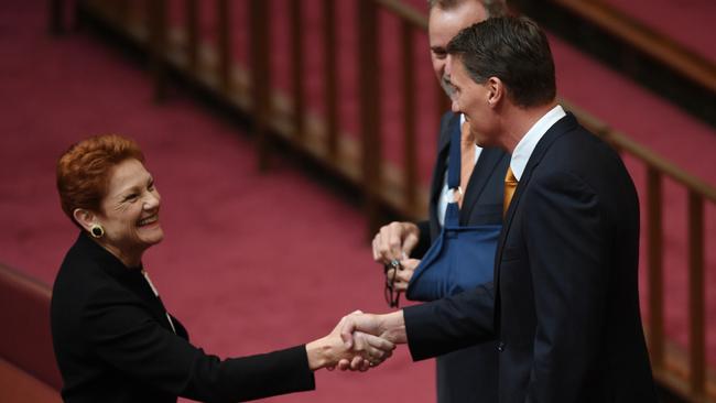 Pauline Hanson talks with Mr Bernardi after he announced his defection. Picture: AAP