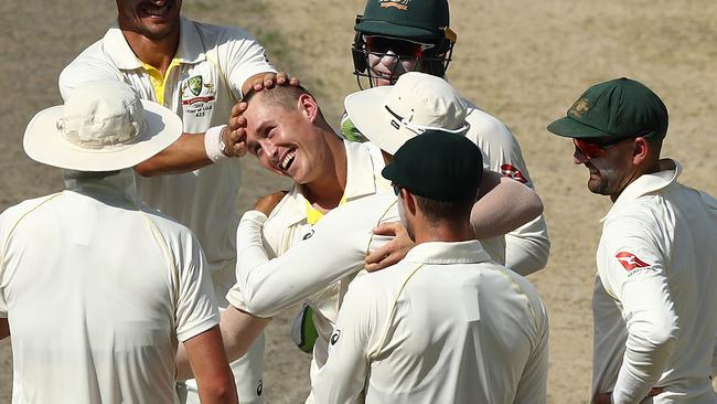 Marnus Labuschagne celebrates his first test wicket with his teammates. Picture: Getty Images