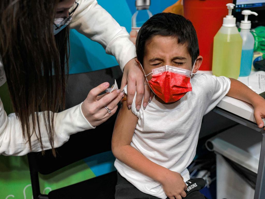 An Israeli health worker administers a dose of the Pfizer/BioNTech Covid-19 vaccine to a six-year-old child in Jerusalem. Picture: AFP