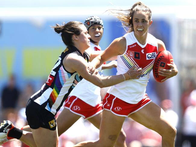 Sydney's Chloe Molloy fends off Collingwood's Sophie Casey during the AFLW Pride Round match between the Sydney Swans and Collingwood at Henson Park on October 29, 2023. Photo by Phil Hillyard(Image Supplied for Editorial Use only - **NO ON SALES** - Â©Phil Hillyard )