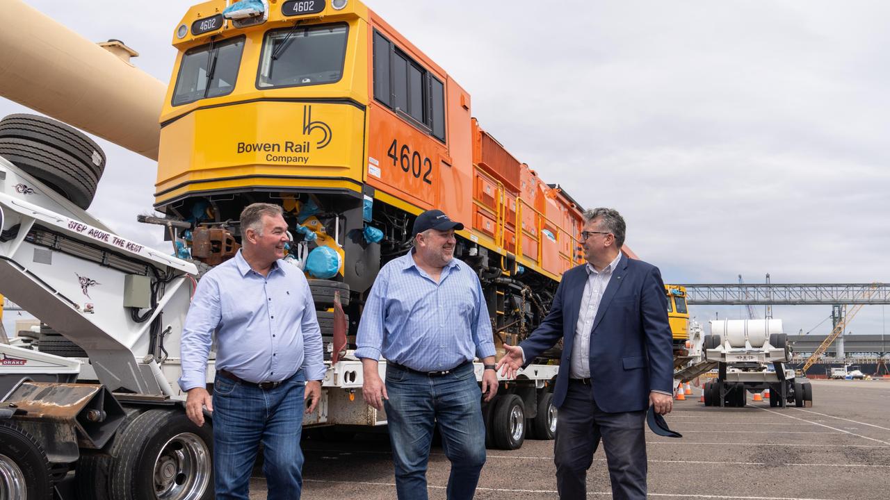 Bowen Rail Company locomotives destined to haul coal for Adani's Carmichael Mine arrive at Port of Townsville. From left to right: Resources Minister Scott Stewart, Adani Australia chief executive Lucas Dow, Federal Resources Minister Keith Pitt.