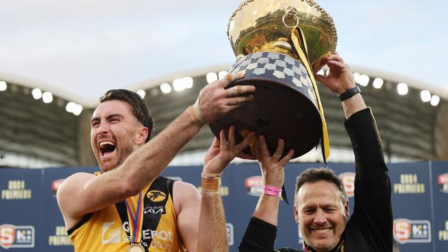 McBean and Tigers coach Darren Reeves celebrate with the trophy. Picture: SANFL Image/David Mariuz