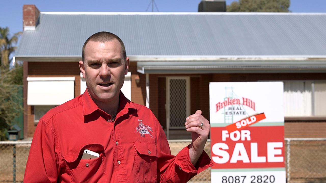 Cliff Wren of Broken Hill Real Estate outside an $80,000 three-bedroom property.