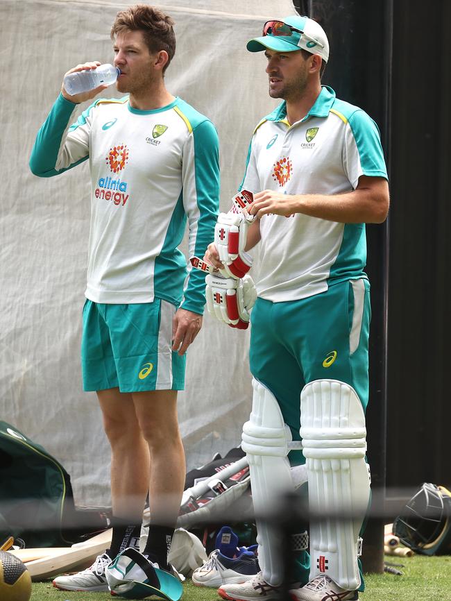 Tim Paine (left) and Joe Burns look on during an Australian net session yesterday. Picture: Getty Images