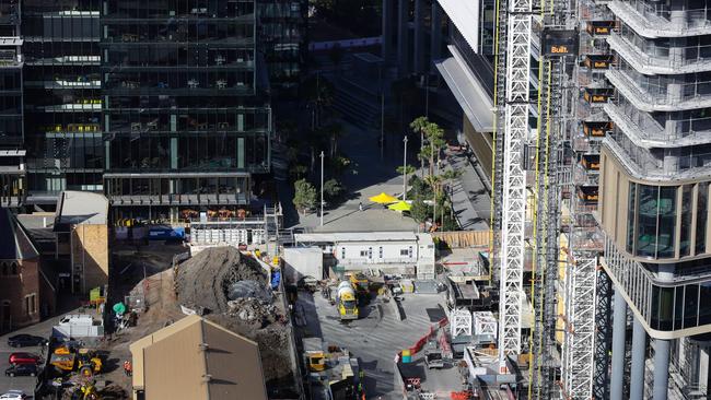 Three months later, images frame the progress with NAB building’s now black facade and the columns soaring on the building to the right. Picture: Gaye Gerard