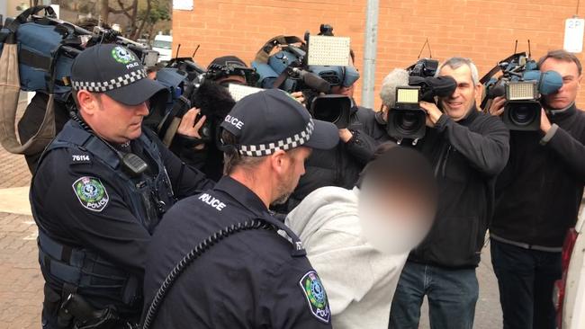 One of the teens charged over Lucy Paveley’s hit-run death is rearrested outside court on Tuesday. Picture: AAP/Tim Dornin