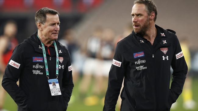 John Worsfold hands over the Essendon coaching job to Ben Rutten after Round 18.