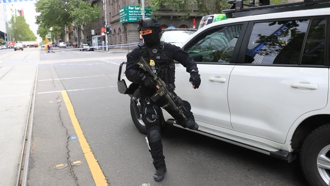 The heavily-armed officer responds. Picture: Alex Coppel