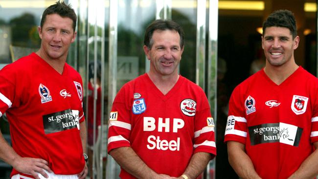 St George Illawarra Dragons players Shaun Timmins (L) and Trent Barrett with ex Steelers captain John Dorahy in a new heritage jersey at St George Leagues Club, Kogarah, Sydney, 05/04/2004.